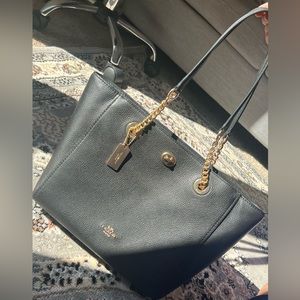 Black and gold coach bag